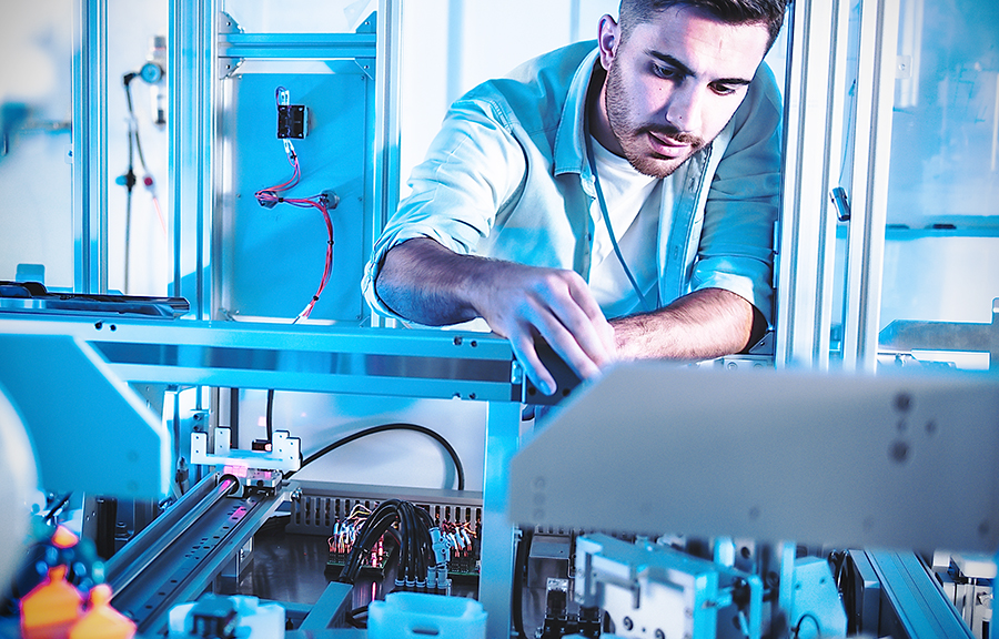 Male Engineers Maintenance Robot Arm at Lab. he are in a High Tech Research Laboratory with Modern Equipment. Technology and Innovation Concept.Professional Japanese Development Engineer is Testing an Artificial Intelligence.start up concept.